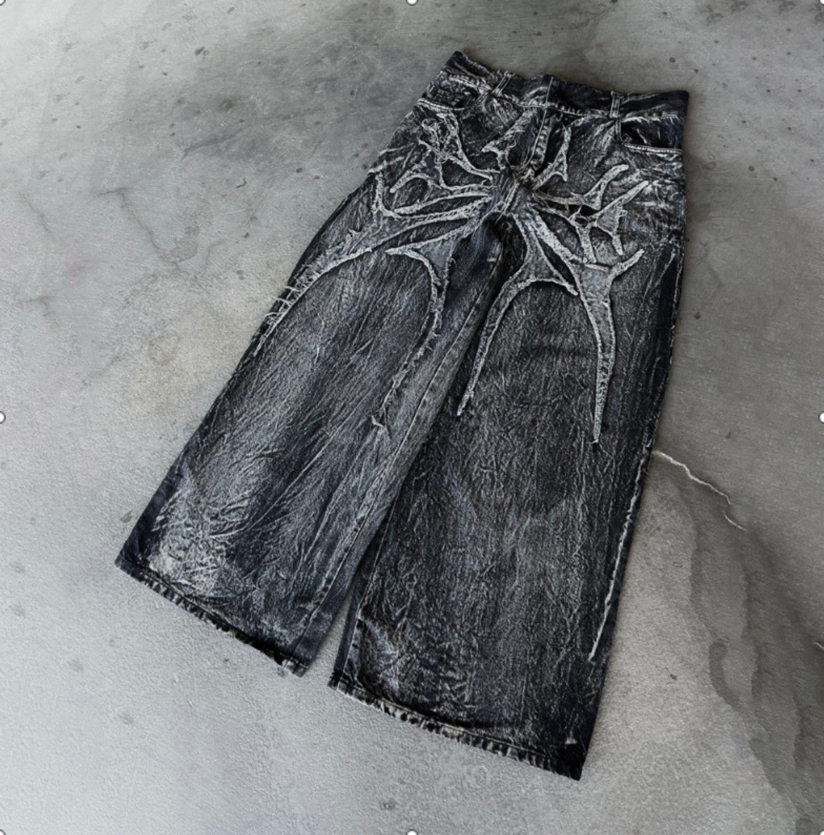 Embroidered spider graphic jeans