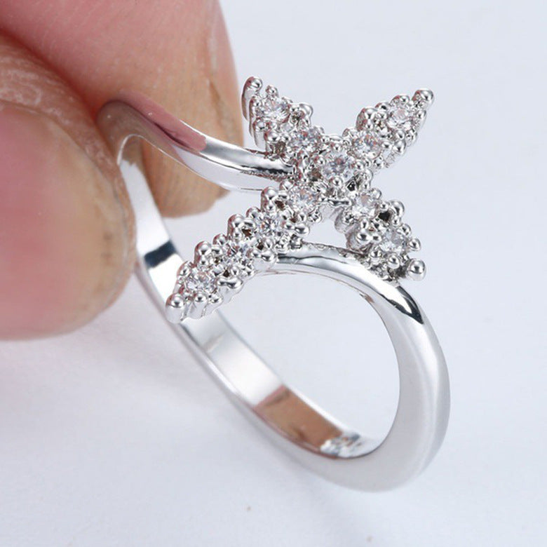 Silver cross ring with diamond accents