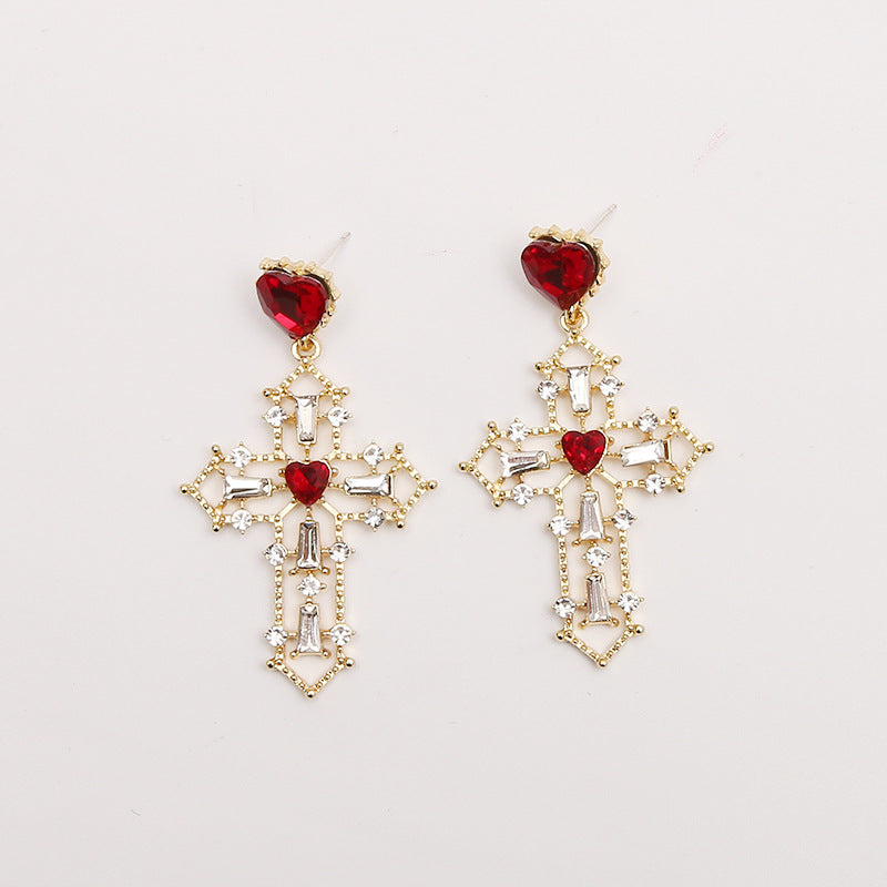 Gold cross earrings with heart design