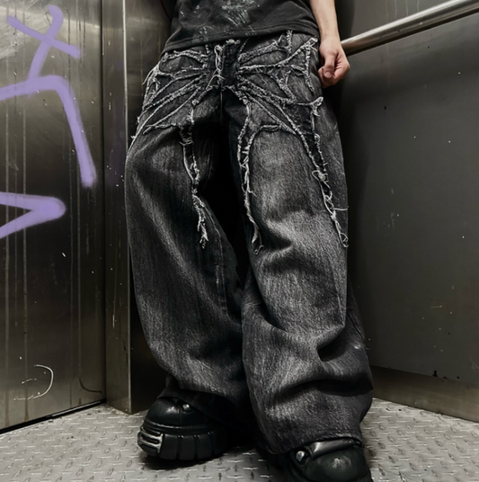Embroidered spider graphic jeans